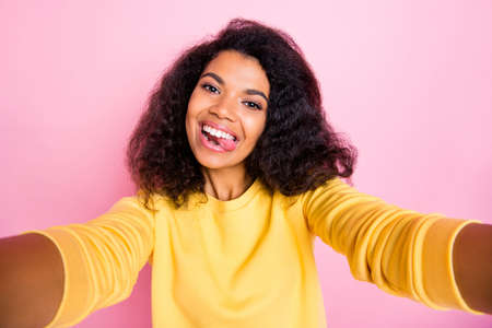 Photo of pretty nice careless positive pretty flirty influencer with charming face showing tongue...