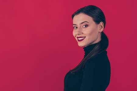 Portrait of charming positive lady look listen to handsome man on luxury party, wear black trendy outfit isolated over red color backgroundの写真素材