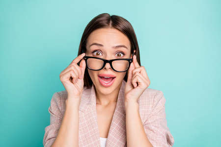 Close-up portrait of her she nice attractive lovely winsome lovable fascinating pretty glamorous cheerful straight-haired lady isolated over bright vivid shine blue green teal turquoise backgroundの写真素材
