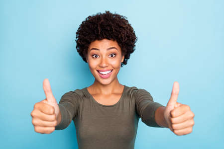 Close up photo of funny funky excited afro american girl show thumb up, recommend promotion wear...