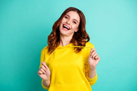 Photo of cute attractive nice beautiful white girlfriend beautiful playing with her hoodie smiling...