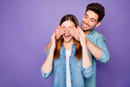 Portrait of two people funky man close eyes of his impressed girl have romantic date holidays wear style clothes isolated over violet color backgroundの写真素材