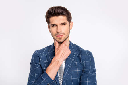Close-up portrait of his he nice attractive well-groomed businessman dandy skilled IT geek specialist wearing blue checked blazer touching chin thinking isolated over light white pastel backgroundの写真素材