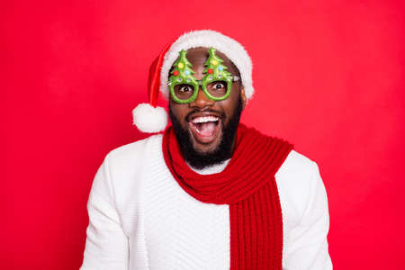 Close up photo of crazy funny emotion expression mulatto hipster guy wear christmas tree specs get...