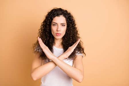 Photo of trendy serious brunette casual confident girlfriend showing you hands crossed restricting...
