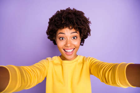 Self-portrait of her she nice attractive lovely charming cute girlish funky cheerful cheery wavy-haired girl spending vacation isolated over violet purple lilac pastel color backgroundの写真素材