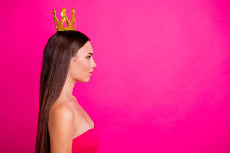 Profile side view portrait of her she nice-looking attractive gorgeous calm content long-haired girl wearing crown copy space isolated on bright vivid shine vibrant pink fuchsia color backgroundの写真素材