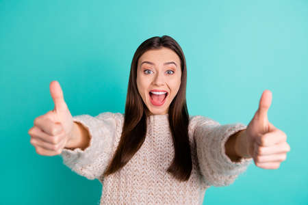 Photo of casual trendy cheerful choosing brown haired girlfriend showing you double thumb up excited...