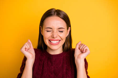 Photo of rejoicing charming cute girl happy with winning some prize knowing result while isolated...