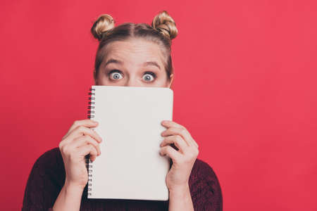 Parents should not know about my bad grades concept. Closeup photo portrait of pretty staring with big eyes teenager terrified about negative stressful news isolated pastel backgroundの写真素材