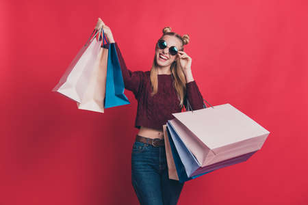 Winter season sales concept. Photo of positive cool beautiful hipster in maroon jumper showing...