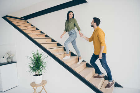 I will show you our bedroom. Full length profile photo of handsome guy and his pretty lady going up...