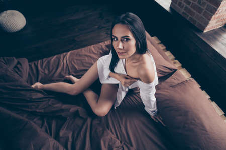 Above high angle view of her she nice-looking attractive lovely lovable pretty nude girl sitting on...