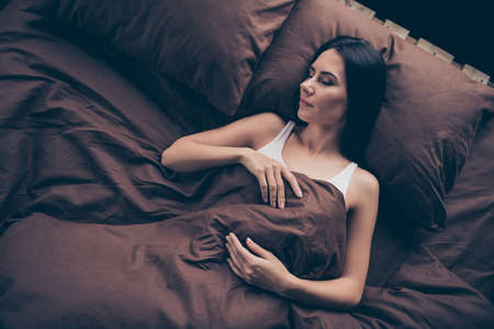 Portrait of her she nice attractive lovely cute calm peaceful girl sleeping covered marsala burgundy veil having rest great nap room flat house indoorsの写真素材