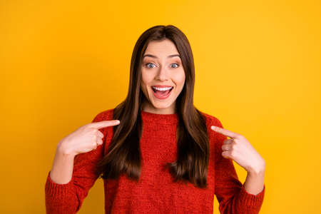 Photo of excited ecstatic cheerful nice beautiful attractive charming, stupor youngster pointing at herself unbelievable information news isolated over vivid color backgroundの写真素材