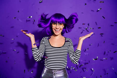 Portrait of cheerful carefree person screaming isolated over purple violet backgroundの写真素材