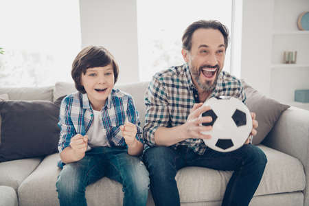 Portrait of two nice attractive lovely cute cheerful cheery overjoyed guys dad and pre-teen son...