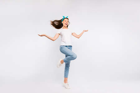 Full size photo of positive cheerful crazy girl hold hands have her hair blowing scream feel dreamy inspired wear pinup pin-up clothing isolated over white color backgroundの写真素材