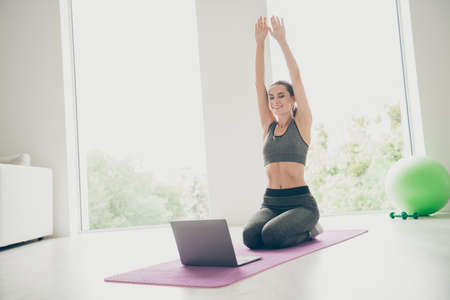 Full length photo of sportive woman watching daily tv sport channel for girls want be slim do cross...
