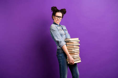 Profile photo of amazing student lady holding many books need to study much carry literature home...