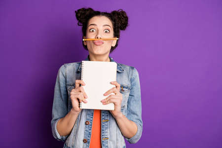 Portrait of funny funky girl do essay want rest relax make break pause fool grimace pencil between...