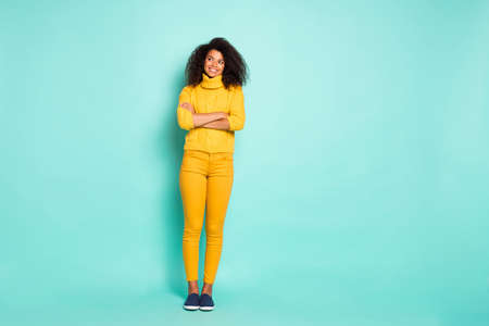 Full length photo of amazing dark skin lady holding arms crossed looking, wondered empty space wear...