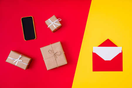 Top above high angle view photo of gift boxes letter cellphone composition, winter tradition season...