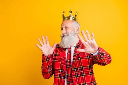 Close-up portrait of his he nice handsome attractive arrogant proud, popular gray-haired man showing deny sign refuse isolated over bright vivid shine vibrant yellow color backgroundの写真素材
