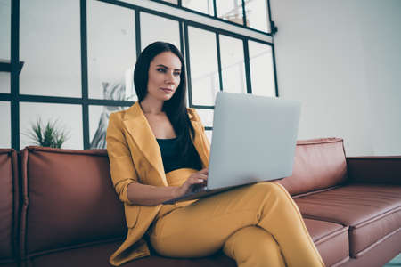 Portrait of her she nice attractive charming gorgeous smart lady launching new real estate app web service start-up in modern style interior glass room flat house apartmentの写真素材