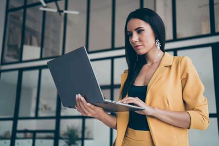 Close-up portrait of her she nice attractive charming stunning pretty gorgeous lady searching web creating site launching start-up in modern style interior glass room flat house apartmentの写真素材