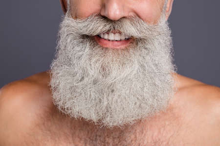 Cropped close up photo of cheerful attractive handsome well old man showing his teeth surrounded...