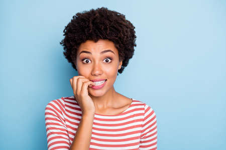 Closeup photo of pretty crazy dark skin lady biting fingers speechless made great mistake feel...