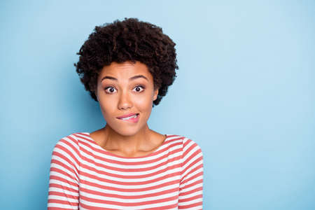 Oops. Closeup photo of pretty dark skin lady biting lips speechless made great mistake feel guilty...