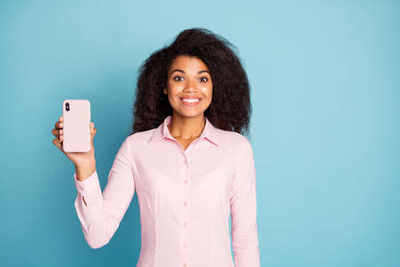 Photo of amazing wavy dark skin lady holding telephone hand demonstrating new smart phone case model...