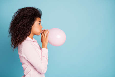 Closeup profile photo of pretty dark skin lady holding hands big air balloon preparing decorations...