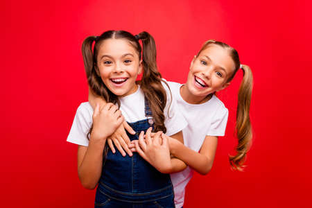 Photo of two funny pretty small ladies spending weekend time together buddies enjoy best holidays...
