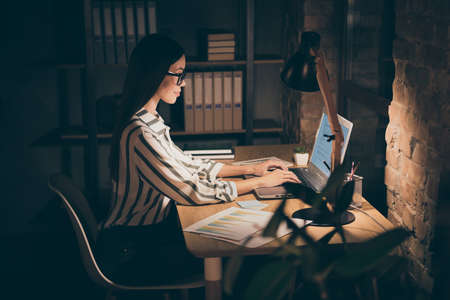 Photo of amazing asian business lady resourceful person looking notebook on table writing report...