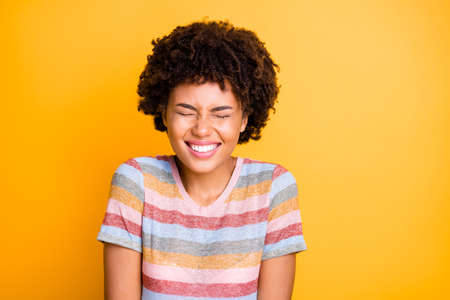 Photo of cheerful cute nice pretty sweet beautiful girl smiling toothily wearing striped t-shirt...