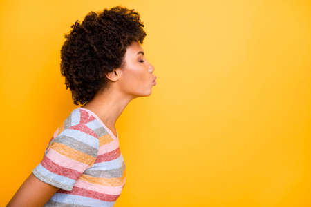 Love can save world. Profile photo of amazing dark skin lady sending air kisses to empty space wear...