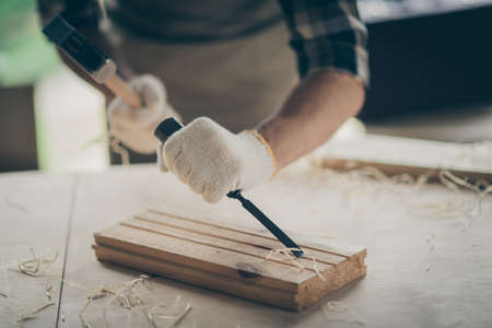 Cropped close-up view of his hands experienced professional guy specialist expert designer creating...