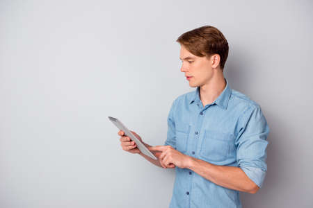 Profile side photo of concentrated man use tablet search websites for education college university...
