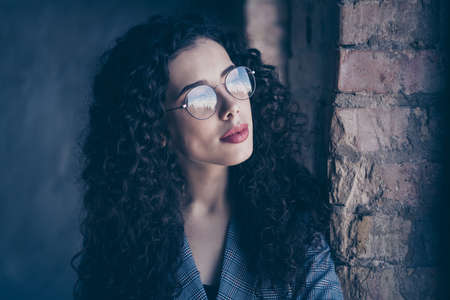 Close-up portrait of her she nice-looking attractive winsome pretty charming lovely lovable glamorous wavy-haired girl at industrial loft brick interior style roomの写真素材