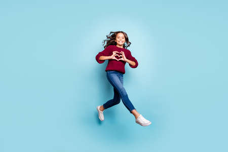 Full length body size photo of cheerful positive girlfriend jumping running showing heart sign...