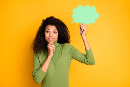 Photo of trendy cheerful positive woman touching her chin holding bubble of thoughtful isolated vivid color backgroundの写真素材