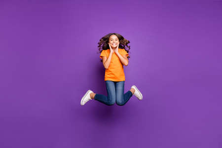 Full length body size view of her she nice attractive charming playful funky cheerful cheery wavy-haired girl jumping having fun free time isolated on lilac purple violet pastel color backgroundの写真素材