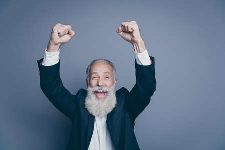 Close-up portrait of his he nice attractive cheerful cheery overjoyed gray-haired man celebrating...