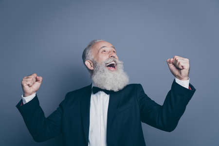 Close-up portrait of his he nice attractive cheerful cheery satisfied overjoyed gray-haired man...