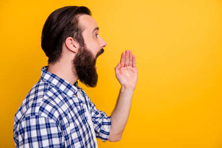 Close-up profile side view portrait of his he nice attractive bearded guy wearing checked shirt...