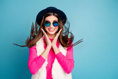Close-up portrait of her she nice attractive lovely lovable stunning gorgeous cheerful cheery girl enjoying free time holiday isolated on bright vivid shine vibrant blue turquoise color backgroundの写真素材