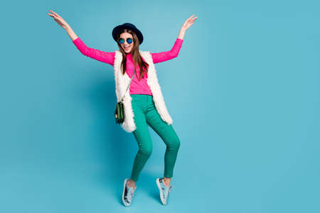 Full length body size view of her she nice-looking attractive funky positive cheerful cheery girl hipster dancing having fun isolated on bright vivid shine vibrant blue turquoise color backgroundの写真素材